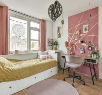 Home interior design of bedroom with bed and wooden wardrobe placed in corner near window in modern apartment
